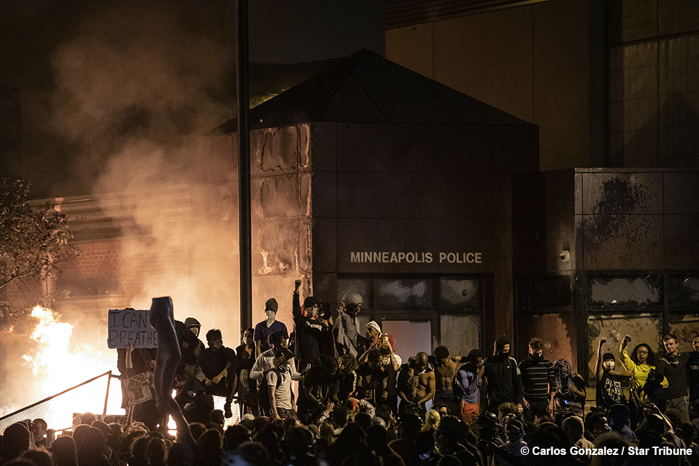 Fireworks were set off as the Minneapolis 3rd Police Precinct burned on Thursday night