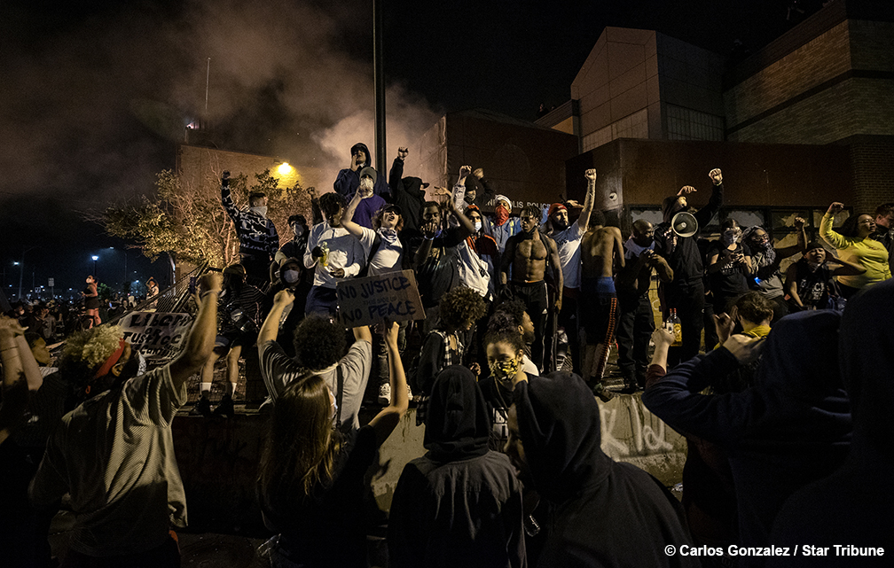 Fireworks were set off as the Minneapolis 3rd Police Precinct burned on Thursday night