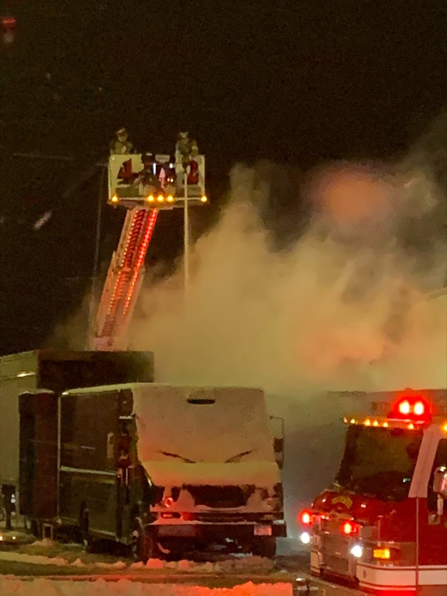 A UPS warehouse in Rochester, Minnesota caught fire Saturday night after several vehicles were burning nearby, the city's fire department says