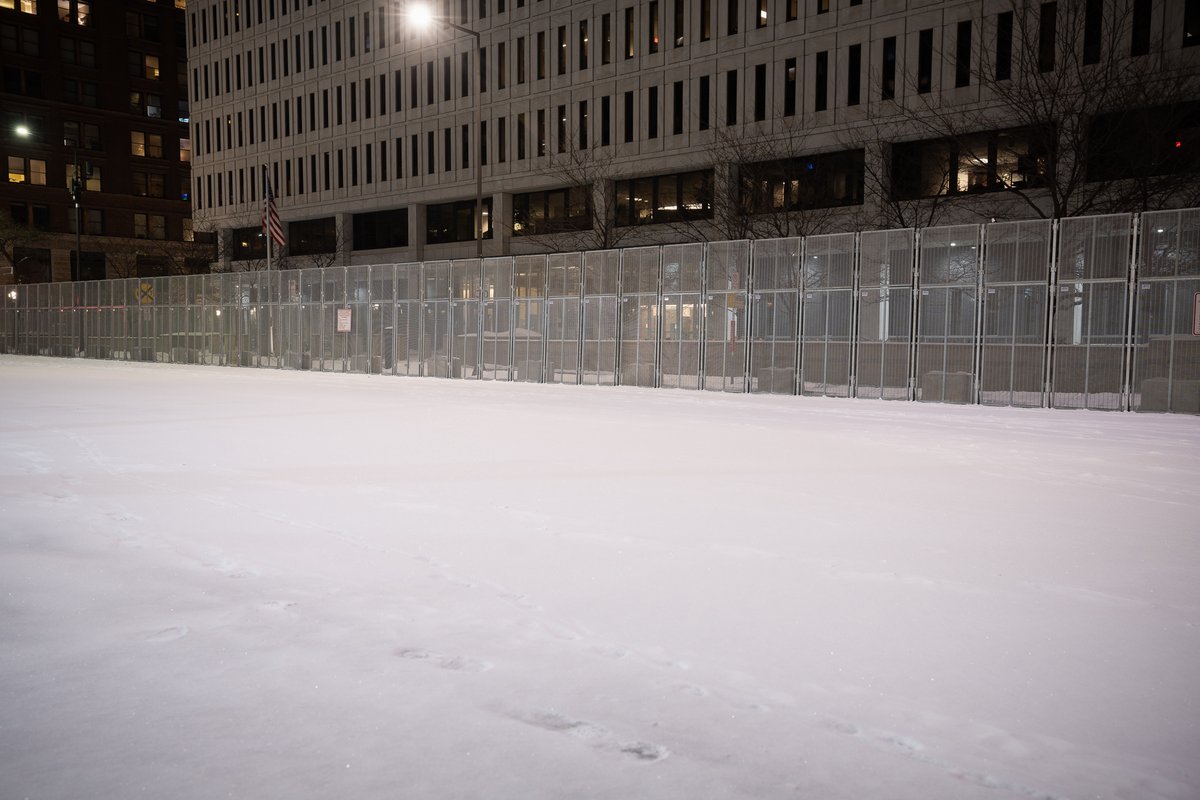 The Federal Courthouse in St. Paul and Ramsey County Downtown Service Center behind security fencing the night before opening statements in trial of officers accused of violating George Floyd's civil rights. Barricades block off a block to be used as a public gathering space