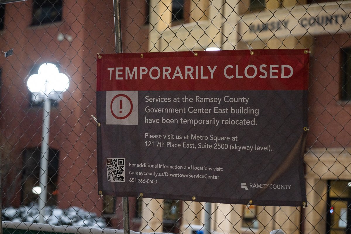 The Federal Courthouse in St. Paul and Ramsey County Downtown Service Center behind security fencing the night before opening statements in trial of officers accused of violating George Floyd's civil rights. Barricades block off a block to be used as a public gathering space