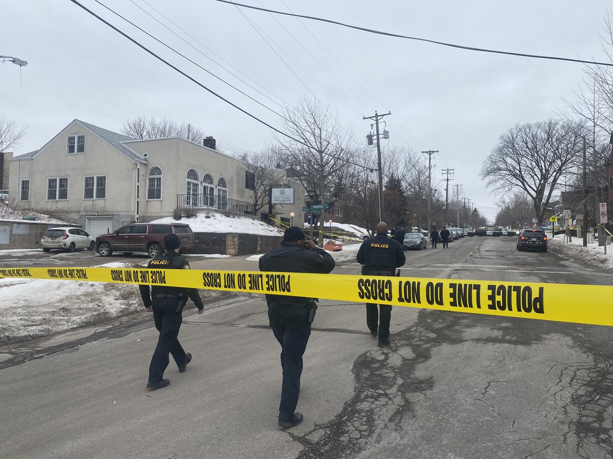 Wabasha Ave in St. Paul taped off for reports of shooting outside funeral home. Crime scene markers on the ground and @sppdmn on scene. 