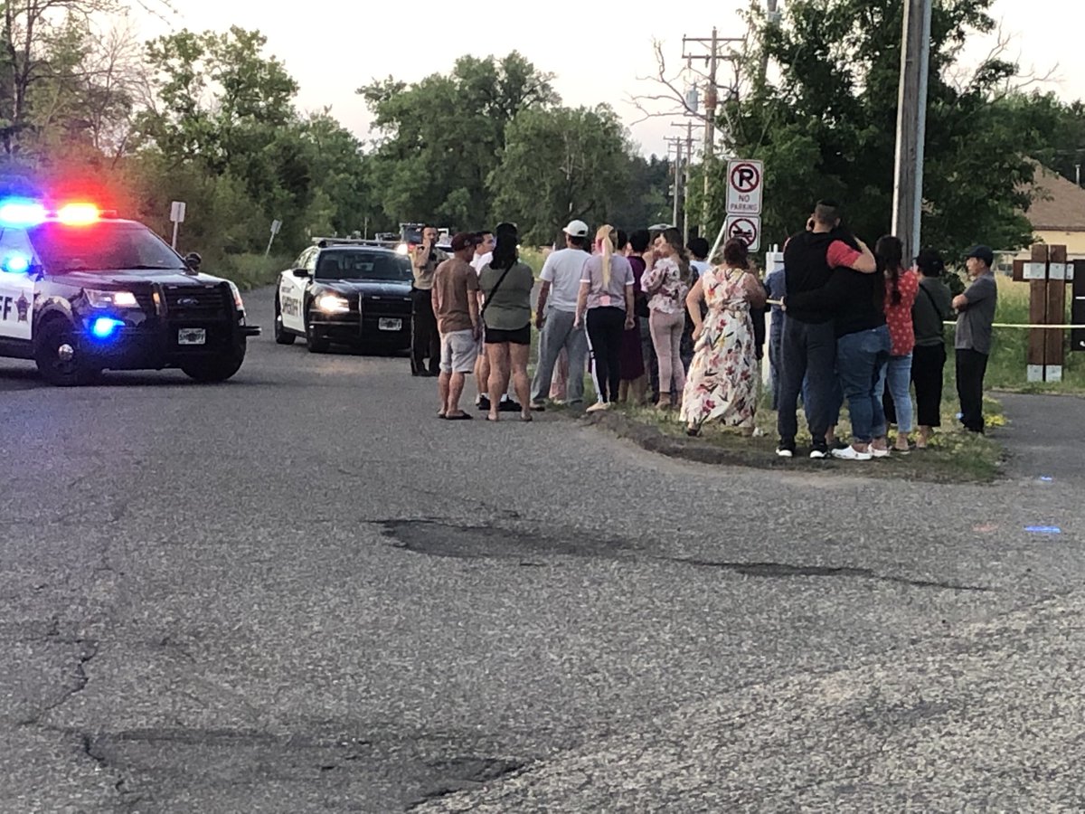 Family and friends crying at road block—as Ramsey County Sheriff's  Divers are in the water at Vadnais Lake in Vadnais Heights. Rescue boats out as well searching. No official update from law enforcement. We have seen the medical examiner vehicle arrive