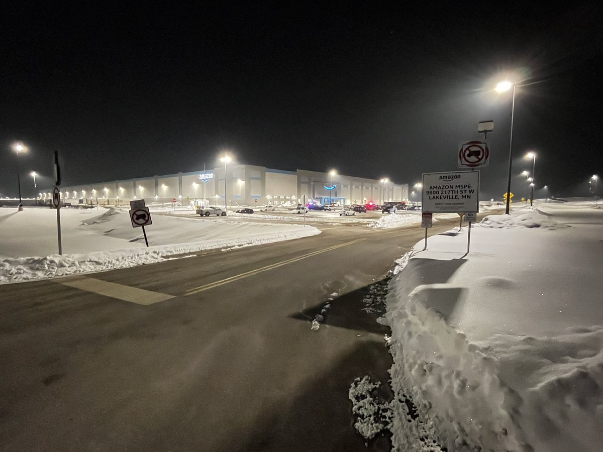 This the scene outside the Amazon Distribution Center in Lakeville, at this hour. @LakevillePD_MN are investigating a shooting in the parking lot that left one woman with life-threatening injuries.