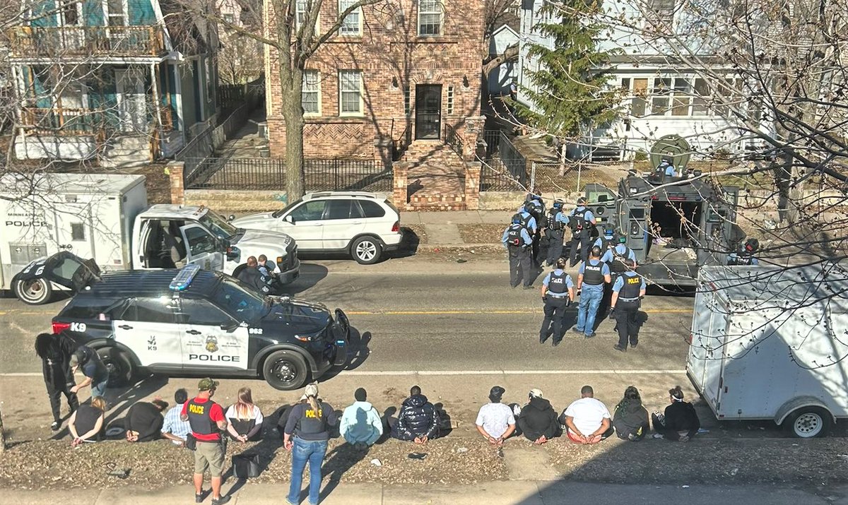 MINNEAPOLIS: A photo submitted by one of our followers shows a warrant being served with SWAT this morning on Cedar Ave., near Lake St. - Several people were called out of a building and detained
