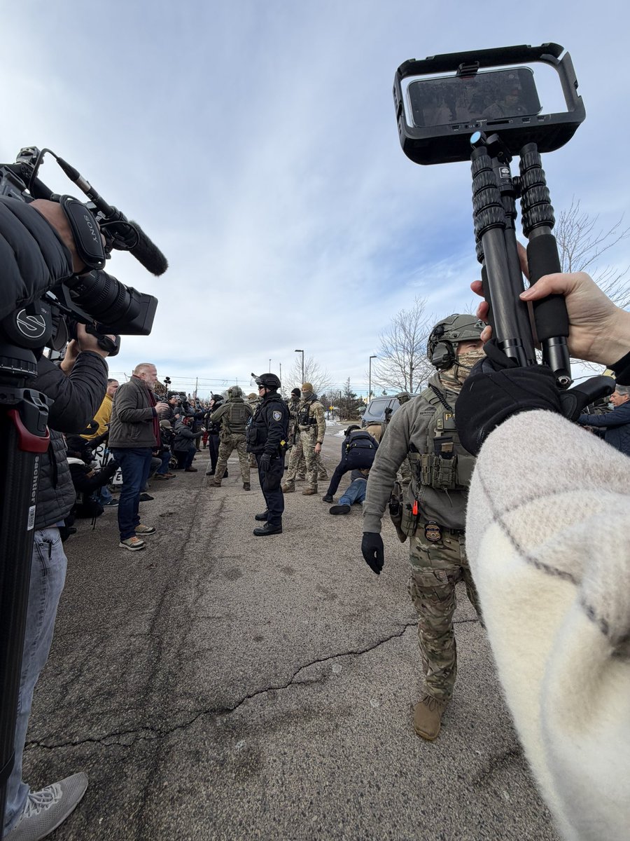 Intense moments outside the federal building near Minneapolis. Two ICE supporters clashed with protesters. One protester has his poor dog in this