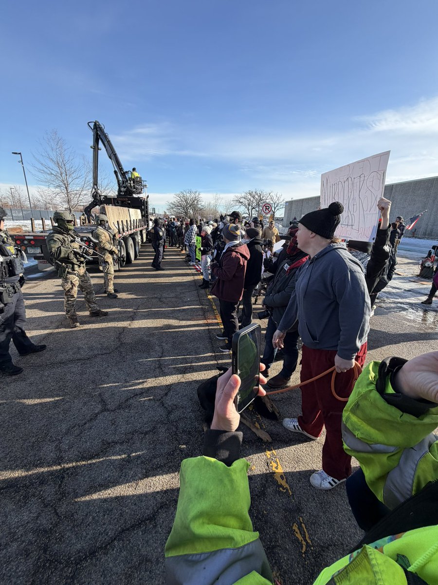 Intense moments outside the federal building near Minneapolis. Two ICE supporters clashed with protesters. One protester has his poor dog in this