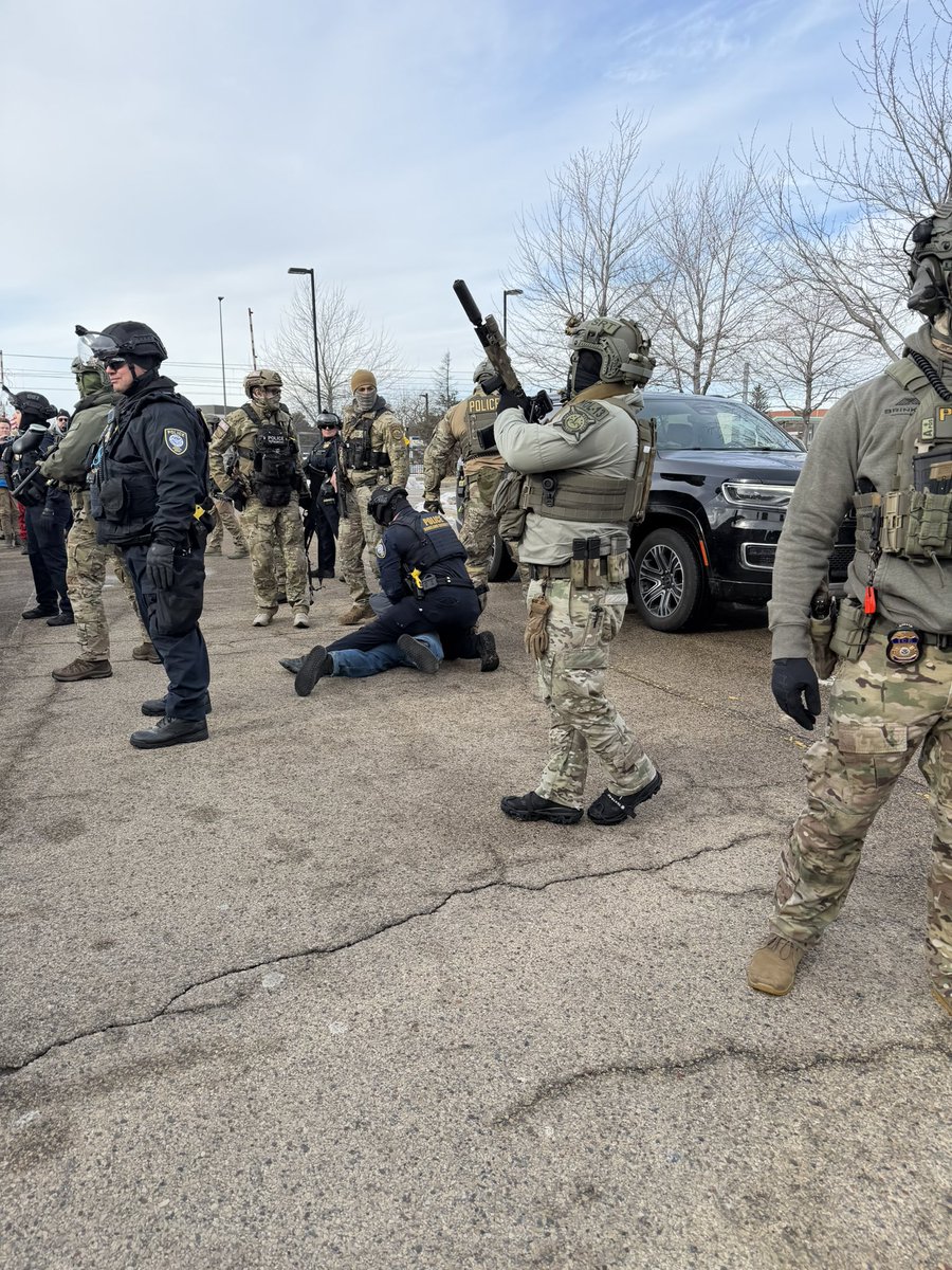 Intense moments outside the federal building near Minneapolis. Two ICE supporters clashed with protesters. One protester has his poor dog in this