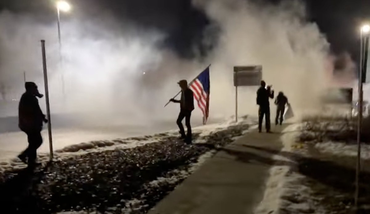 A group of around 100 protesters is clashing with officers outside the Whipple Federal Building, just east of MSP Airport, with fireworks being launched from the crowd towards officers around 9:45 p.m. including at least one that appears to have exploded directly underneath a law