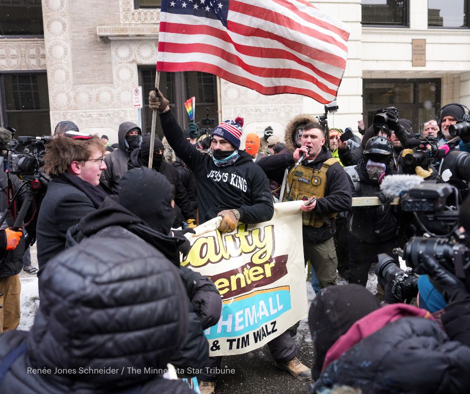 Groups from competing protests confronted each other in downtown Minneapolis Saturday as police tried to keep them separated 