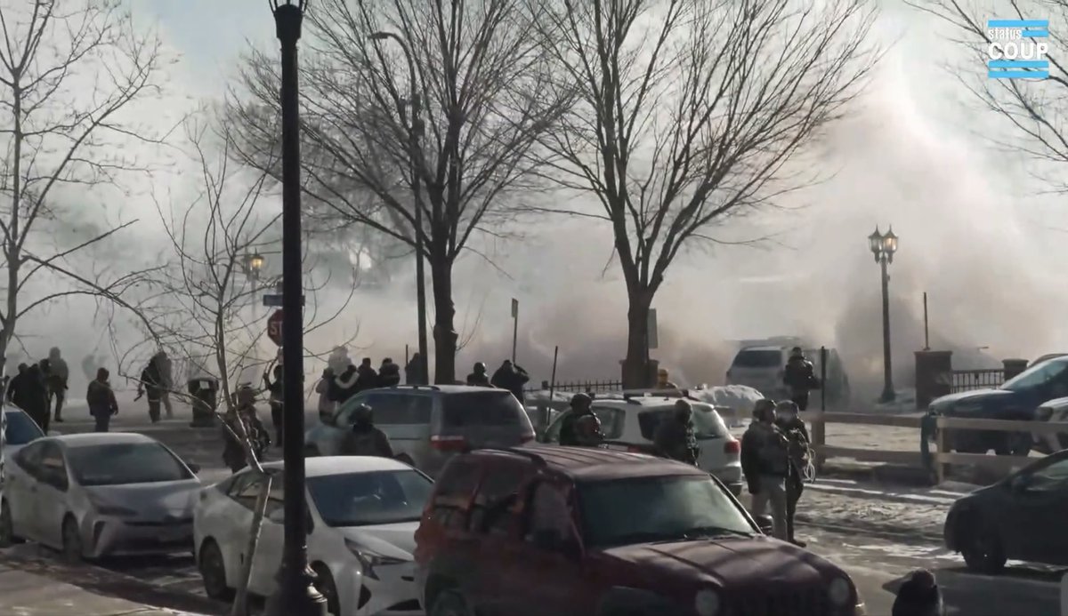 Hundreds of protesters are at the scene of a shooting involving federal agents in Minneapolis. They are blocking the road with large trash bins