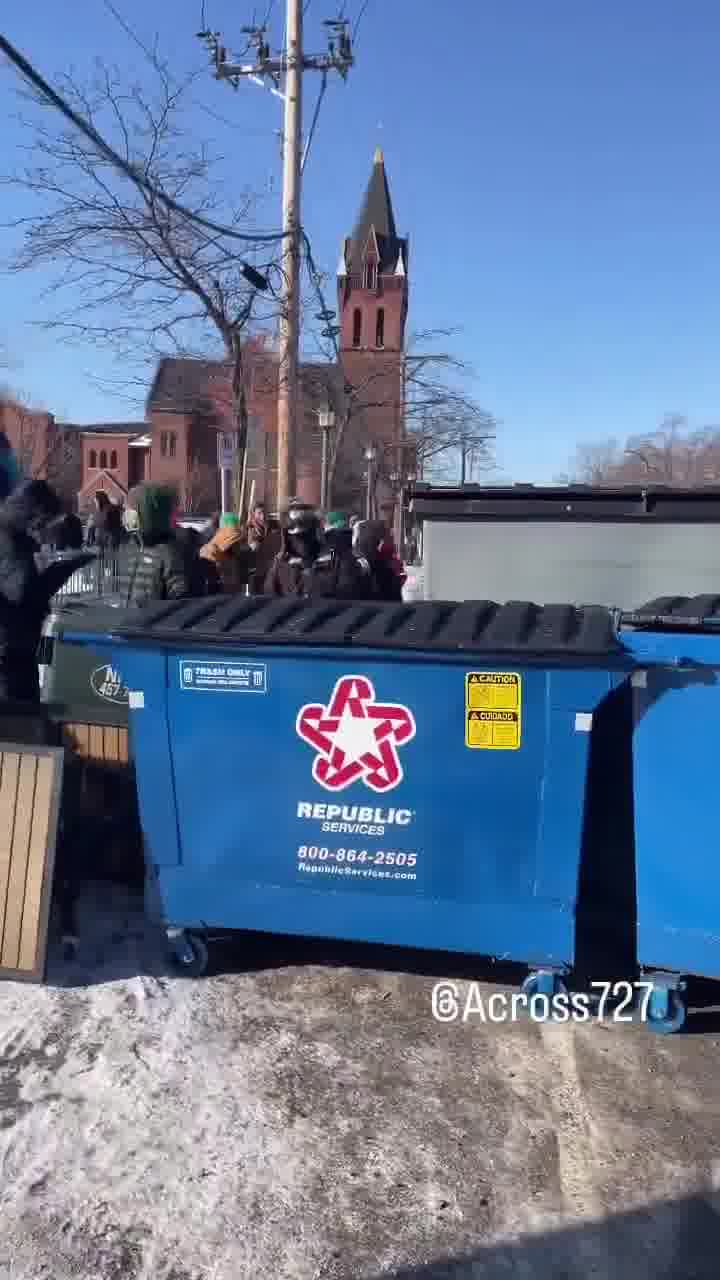 Protesters have barricaded the roadway after an ICE-involved shooting, trapping federal agents at the scene. Crowds are blocking exits as tensions explode and officers reportedly deploy chemical irritants to force a way out